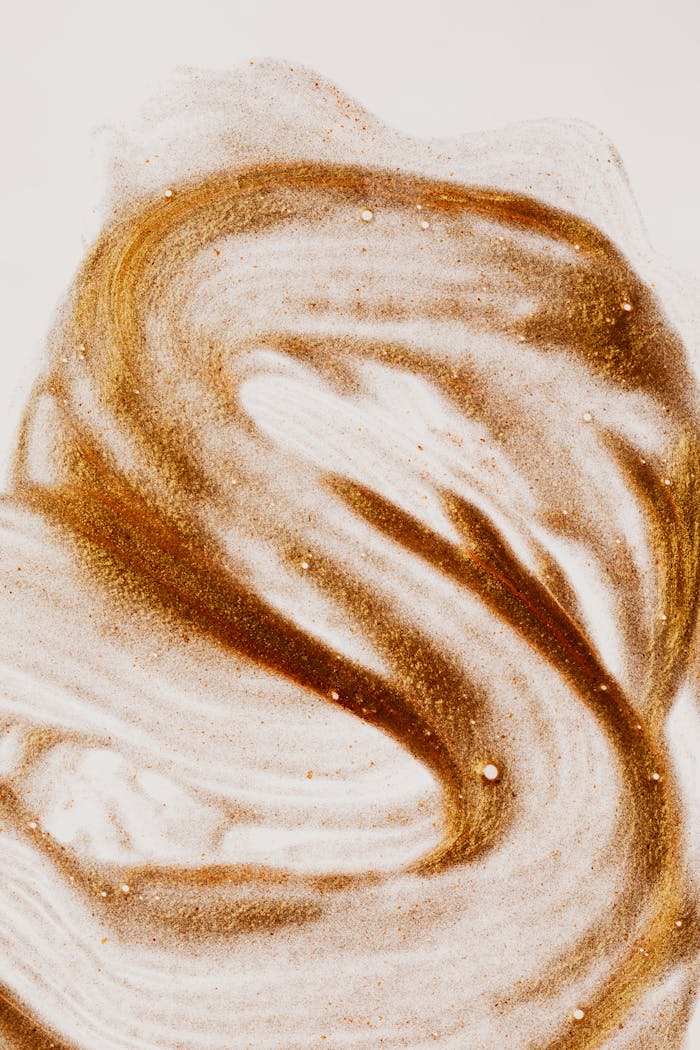 services-03 Top view flat lay composition of picture painted with brown colored sand on white paper